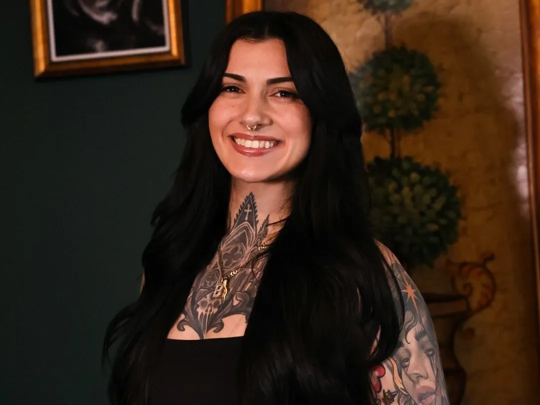 Portrait of Tina smiling in the Famiglia Ink studio